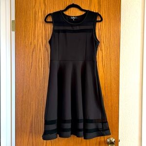 Black Lulu’s fit and flair dress with sheer mesh detail